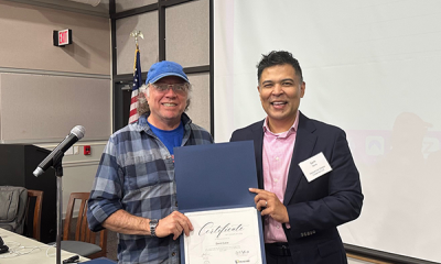 Completion certificate for LLNJ’s PM Fundamentals + AI Integration Bootcamp, presented by Sam Sena (right) to David Cubie, West Orange Public Library
