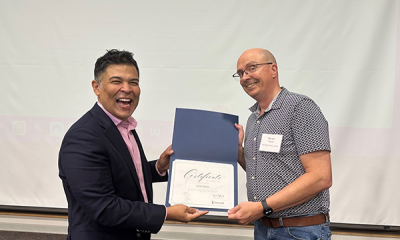Completion certificate for LLNJ’s PM Fundamentals + AI Integration Bootcamp, presented by Sam Sena (left) to Darren Miguez, Plainsboro Public Library